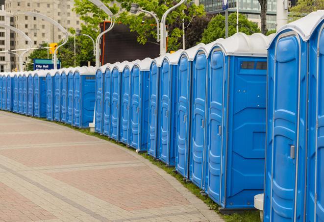 a row of portable restrooms for a special event, ensuring guests have access to clean facilities in Bartlett, TX